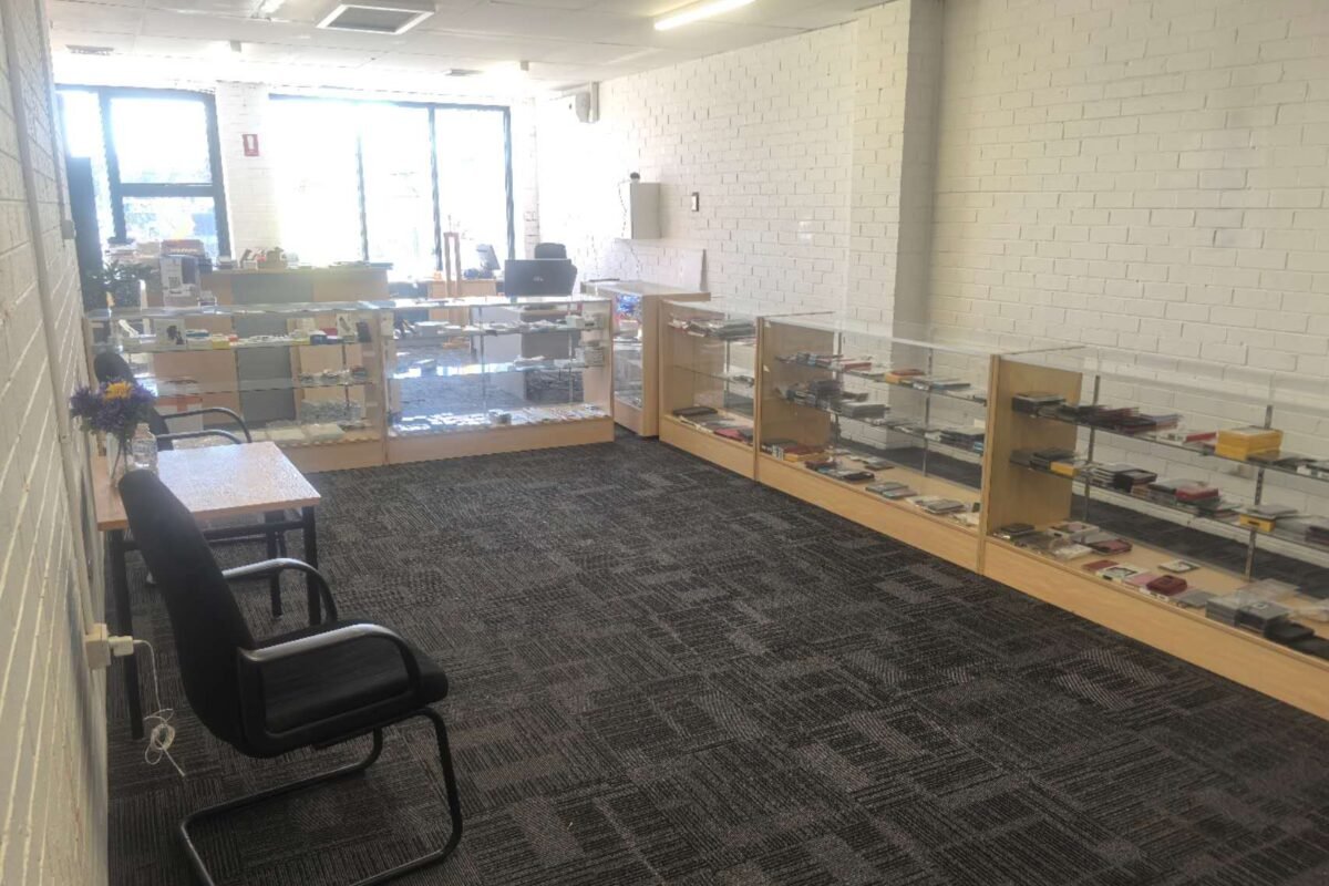 Inside the DT Repair workshop upstairs at Mountain Gate, with stock displayed in glass cabinets